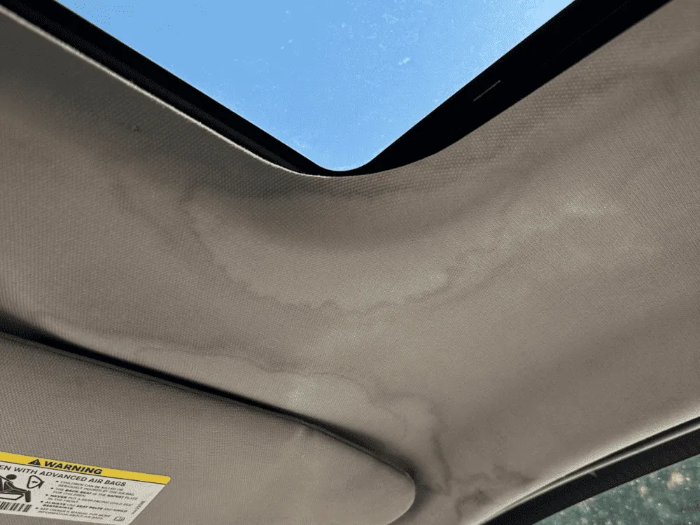 Stained car ceiling – Before